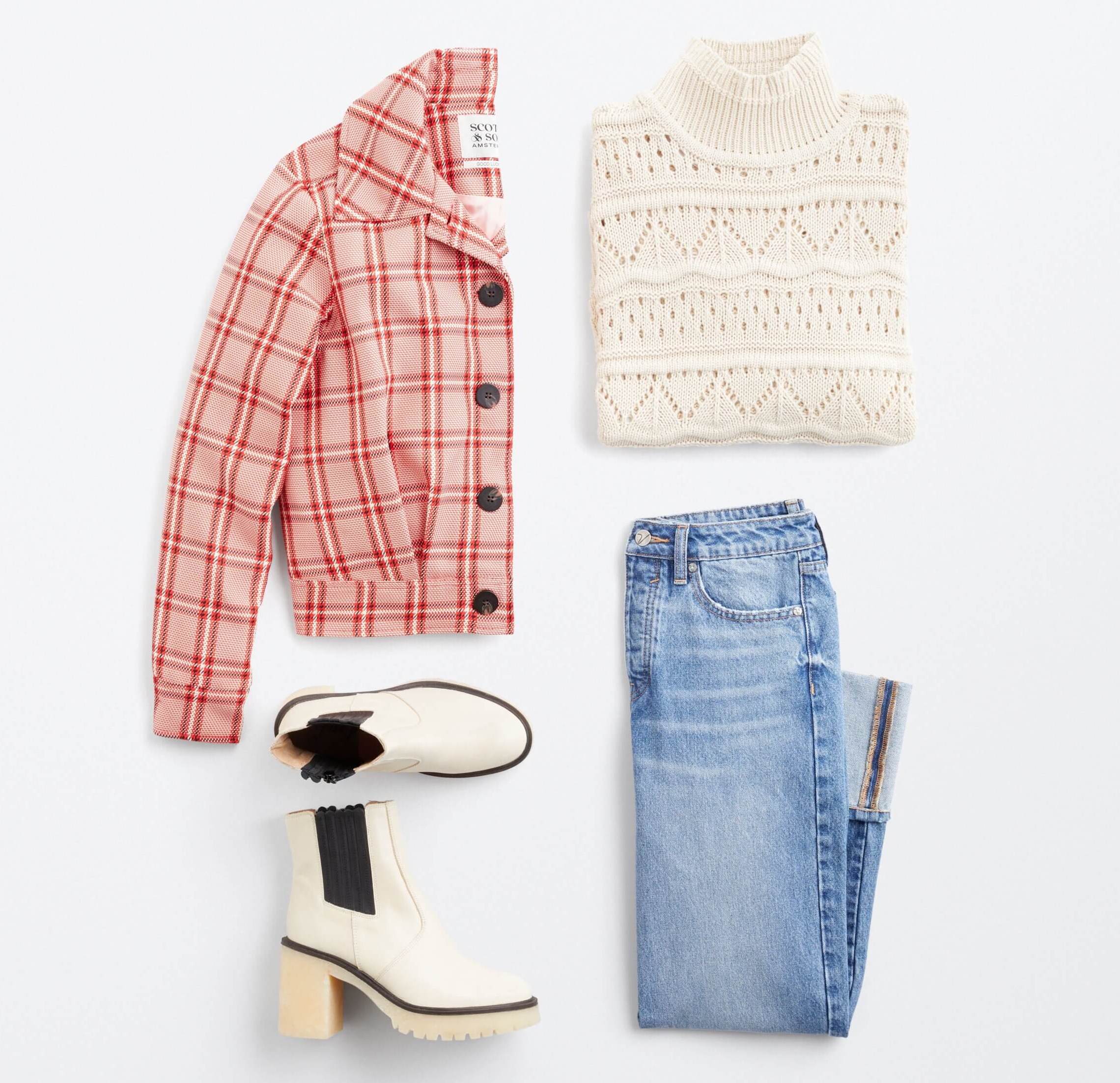 Một bộ trang phục phẳng bao gồm áo khoác, áo len, quần jean và giày bốt 